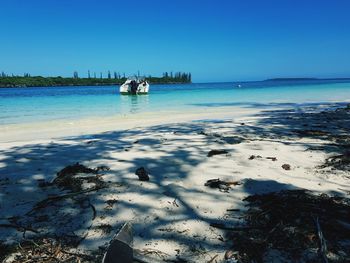 Scenic view of sea against clear blue sky