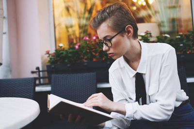 Young man using laptop at table