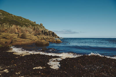 Scenic view of sea against clear blue sky