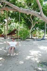 Portrait of smiling sitting on beach