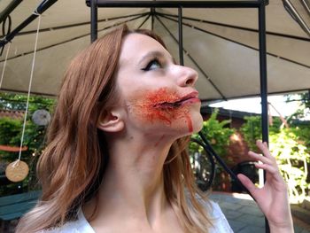 Close-up of woman with zombie make-up