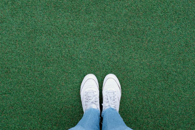 Low section of person standing on ground