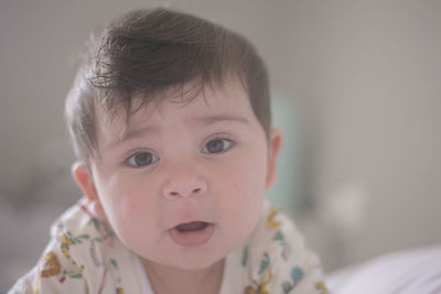 Portrait of cute baby girl at home