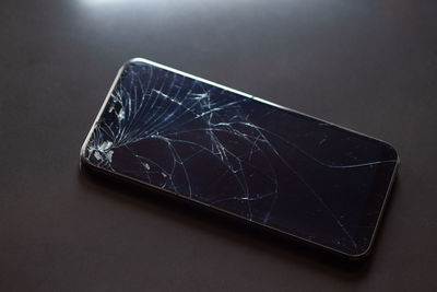 High angle view of smart phone on table