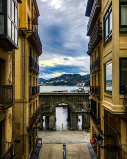Buildings in town against sky