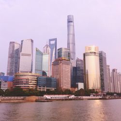 View of city waterfront against sky