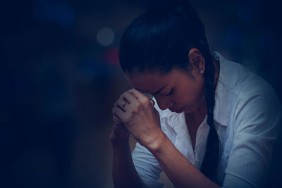 Close-up of woman praying