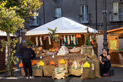 People at market stall