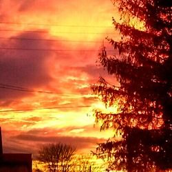 Low angle view of cloudy sky at sunset