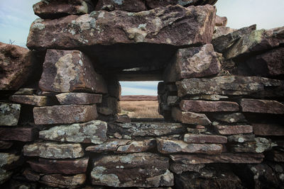 Low angle view of stone wall