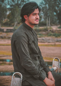 Side view of young man looking away