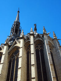 Low angle view of temple against clear blue sky