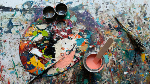 High angle view of various paint on table