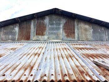 Low angle view of roof against sky