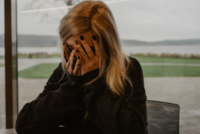 Portrait of young woman crying, depression, mental health