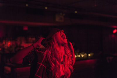 Young woman performing at a nightclub