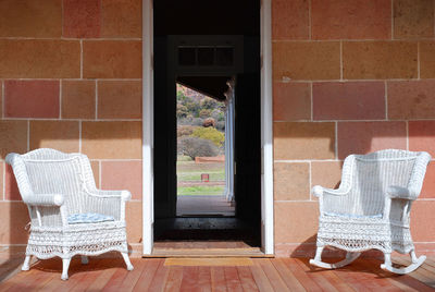 Empty chair against wall at home