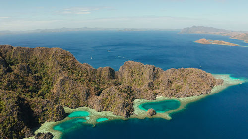 Aerial drone lagoons and coves with blue water among the rocks. seascape, tropical landscape. 