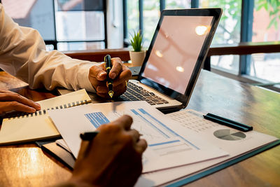 Man using laptop on table