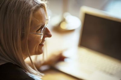 Woman calculating success, hands-on strategies for office productivity