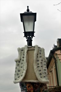 Low angle view of street light against sky