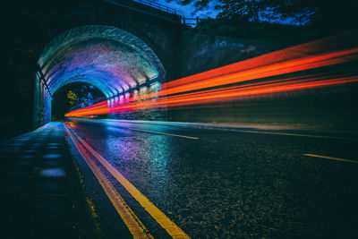 High angle view of light trails on road at night