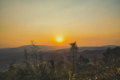 Scenic view of landscape against sky during sunset