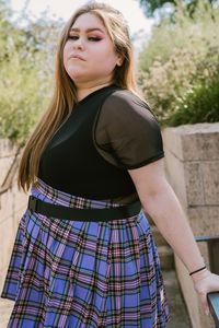 Portrait of teenage girl standing outdoors