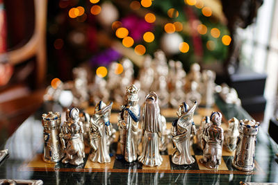 Close-up of chess pieces on table