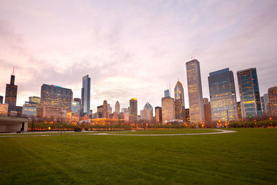 View of buildings against cloudy sky during sunset