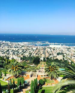 Terraces of the baha i faith and buildings against sea in city