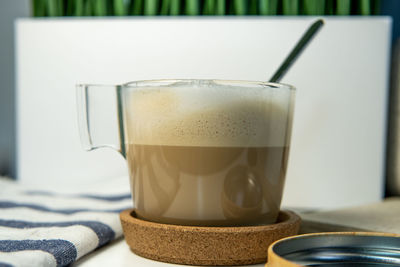 Close-up of coffee cup on table