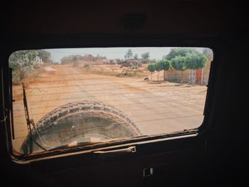 View of landscape through car window