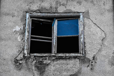 Close-up of window of abandoned building