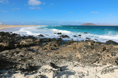 Scenic view of beach against sky