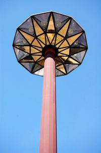 Low angle view of basketball hoop against clear blue sky