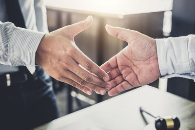 High angle view of business people doing handshake