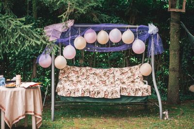 Balloons hanging on the swing at yard