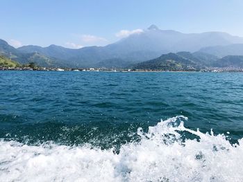 Scenic view of sea against clear blue sky