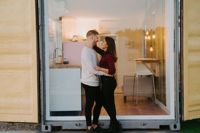 Full length of couple standing outdoors