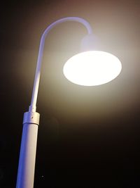 Low angle view of illuminated light bulb