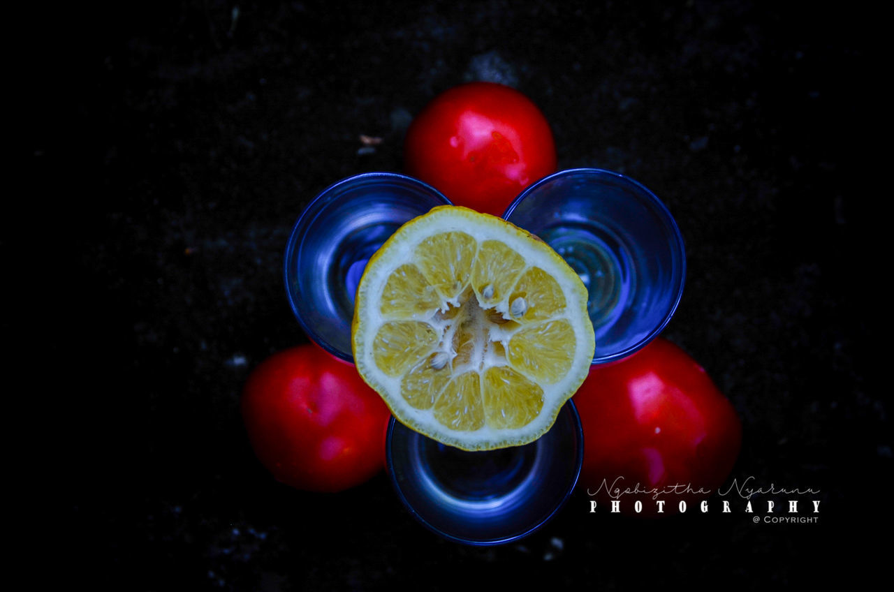 fruit, food and drink, food, healthy eating, red, still life, freshness, no people, citrus fruit, lemon, indoors, close-up, wellbeing, slice, blue, refreshment, glass, focus on foreground, tomato, drink, black background