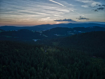 Scenic view of mountains against sky at sunset