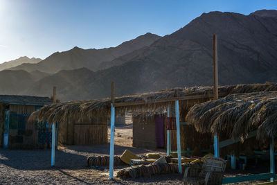 Panoramic view of beach and mountains against clear sky