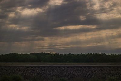 Scenic view of landscape against cloudy sky