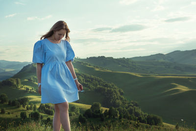 Woman walking outdoors against sky