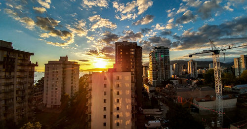 Cityscape against sky during sunset