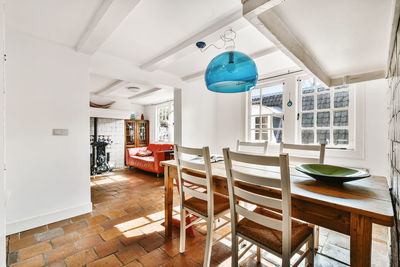 Empty chairs and tables in building