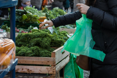 Midsection of man holding hands