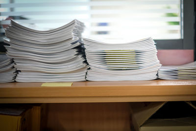 Stack of papers at table